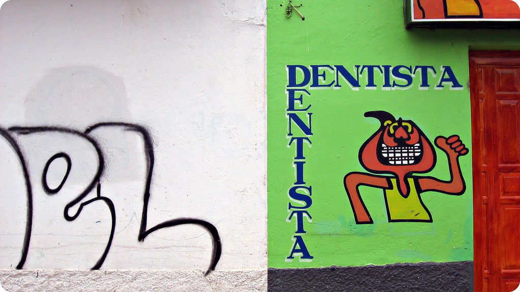 A person smiling confidently with straight teeth